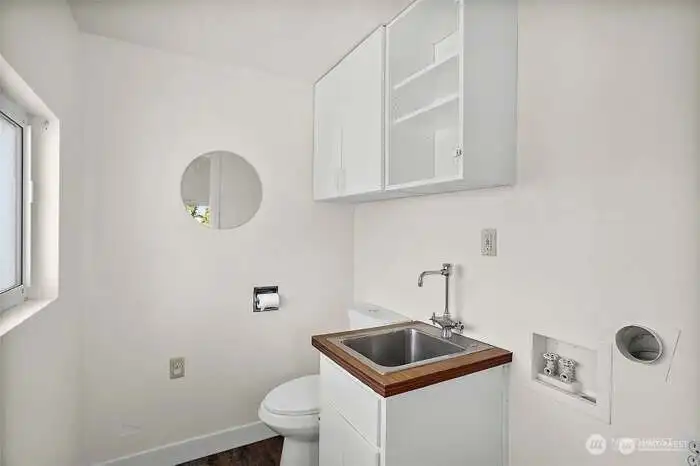 Half Bath at Back Entry also houses the washer/dryer area Half Bath at Back Entry also houses the washer/dryer area
