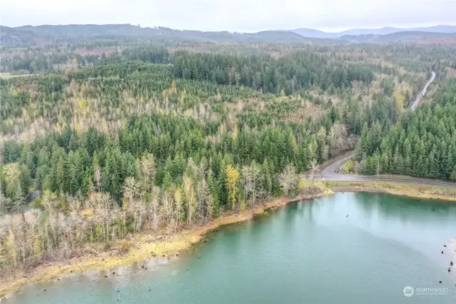 Far left shows main entrance to Sunny Beach Point. Paved & marked parking spaces, trails, swimming area, picnic shelter & picnic spots with BBQs.