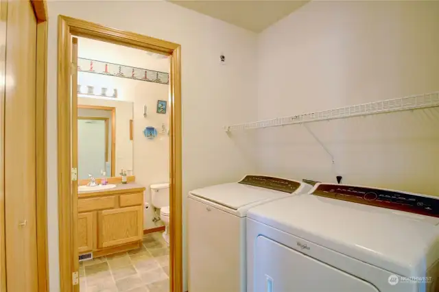 Utility room leads into powder room on the main floor