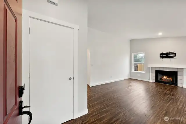 Front door opens into the Living space. Coat closet on left.