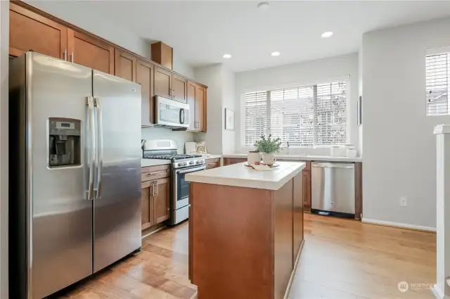 Kitchen with island - wired for pendant lighting! All appliances stay with the home