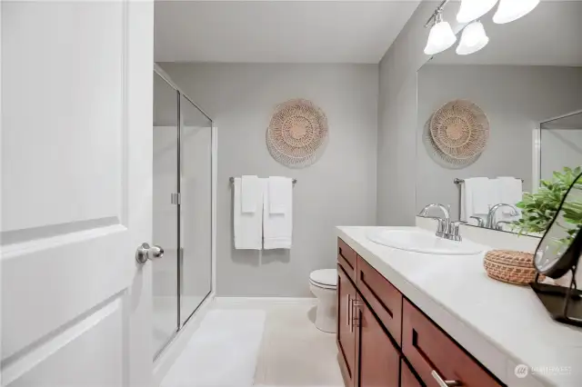 Bathroom suite with dual sinks and large shower