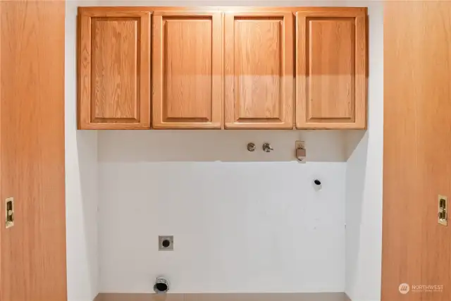 A laundry closet with storage is conveniently located.