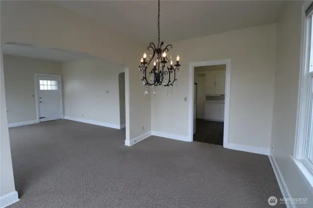 Dining area and living room to the left.
