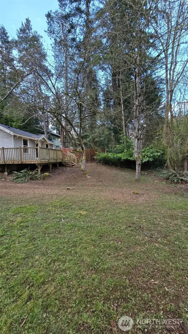 Stairs coming from the deck to the yard. Lots of room to enjoy summer games.
