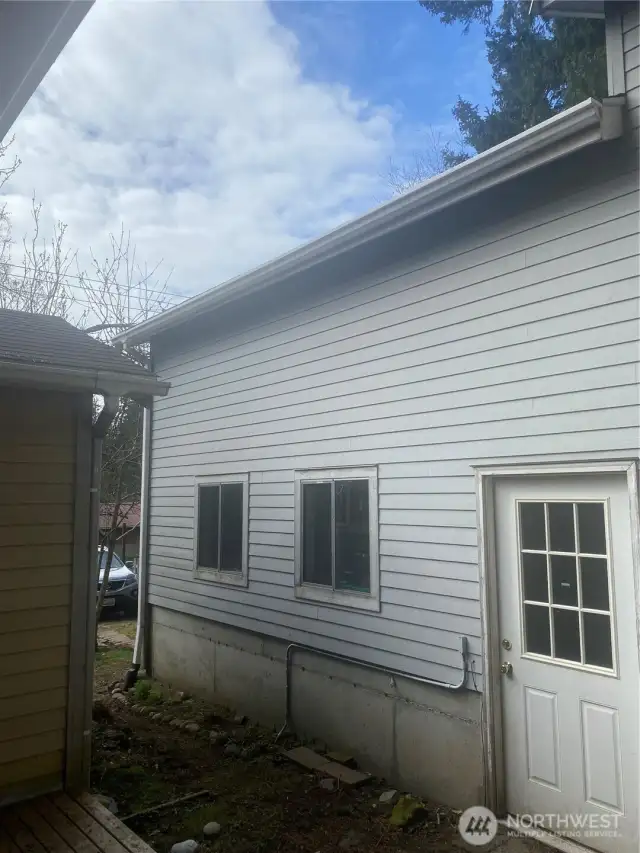 side of garage that faces back porch to house