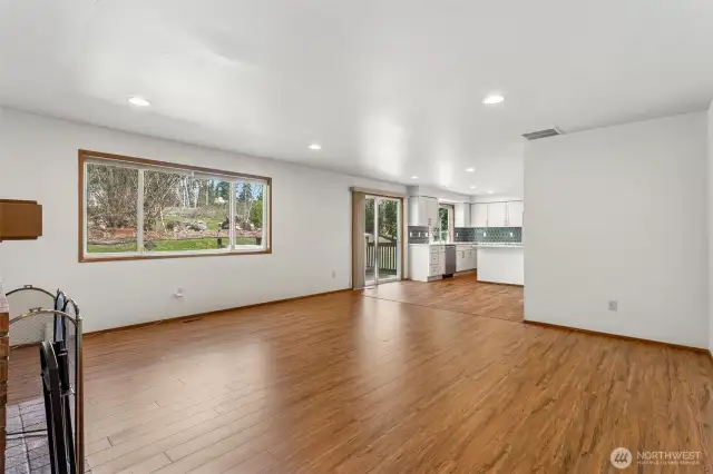 Sliders off the kitchen open to the deck and backyard.