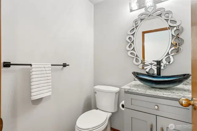 Updated main floor bath with quartz countertop.
