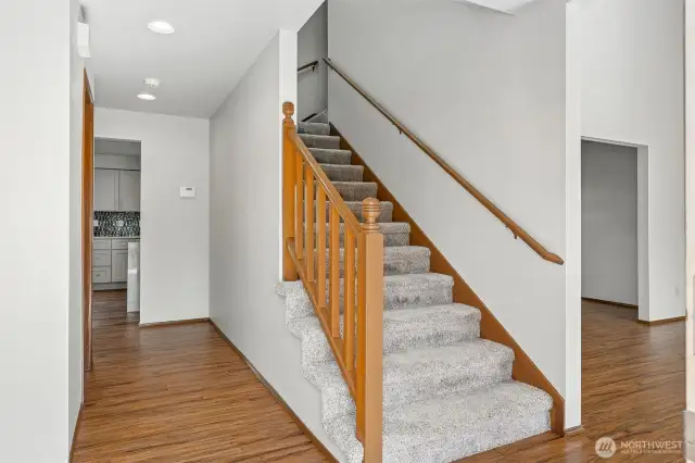 Entry with engineered hardwood floors that extend throughout the main living areas.