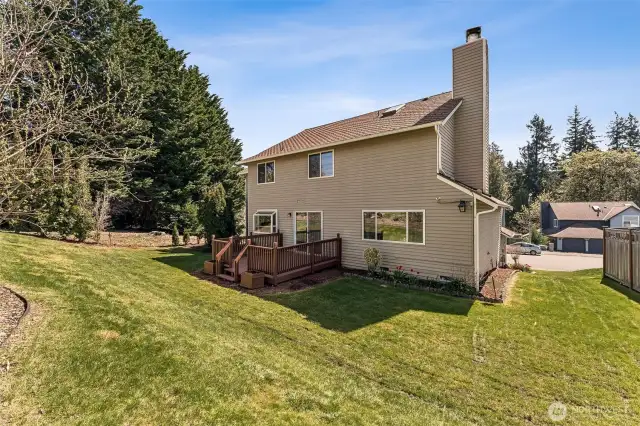 Back exterior with a deck for relaxing or entertaining.