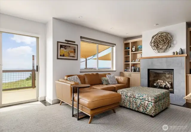 Main level family/sitting room next to the kitchen showing slider to view deck