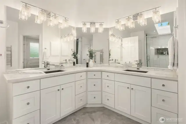 primary bathroom with dual vanities