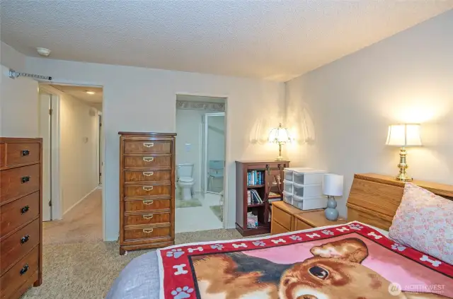 You can see the 3/4 bath off the primary bedroom .