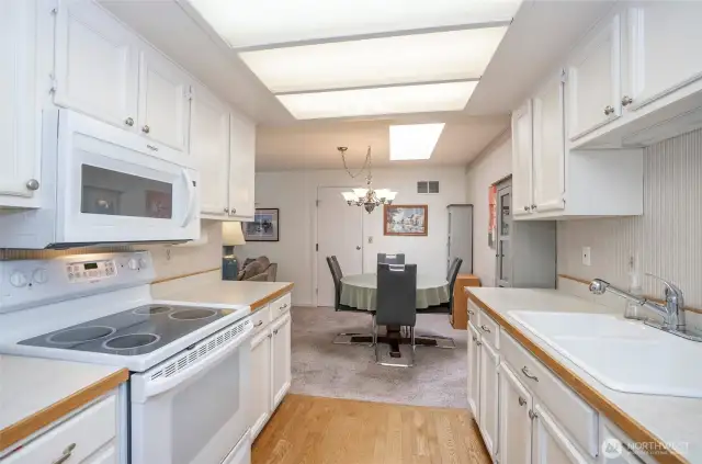 Efficient galley kitchen into dining area.