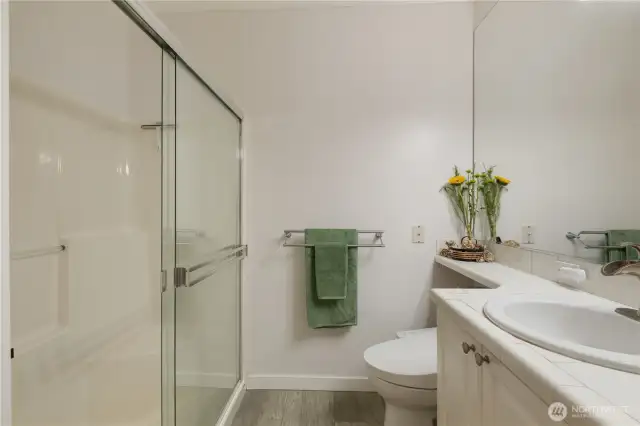 Additionally, this Master Suite Bathroom has a  Shower Boasting Two Built-in Seats.