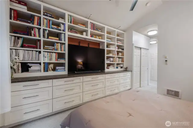 These Custom Crafted Built in Shelves and Dresser Unit provide elegance,  function, and, sophistication to this already stunning Master Suite