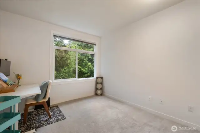 On the left side of the Hall way near the Second Bathroom you'll find the Second Bedroom. This Bedroom Faces South Easterly, with Beautiful Views of the Sitting Park and Greenbelt through a Large  Window With Custom Trim & Mill Work for a truly Picturesque "Good morning".