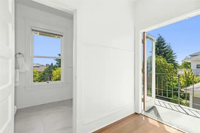 From your walk-in wardrobe/closet one may step outside to a south facing balcony or into a freshly updated 3/4 bathroom.