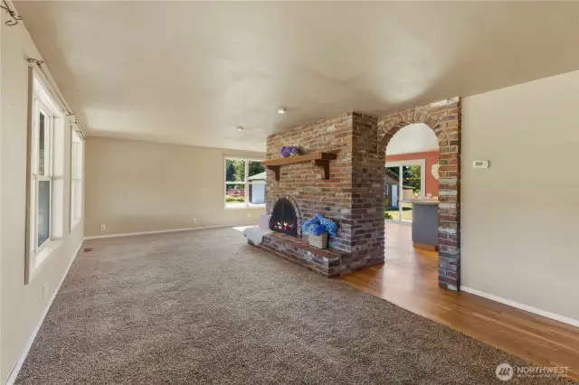 Living room with historic brick feature wall.