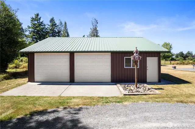 Covered parking. Easy access to barn from either side of building.