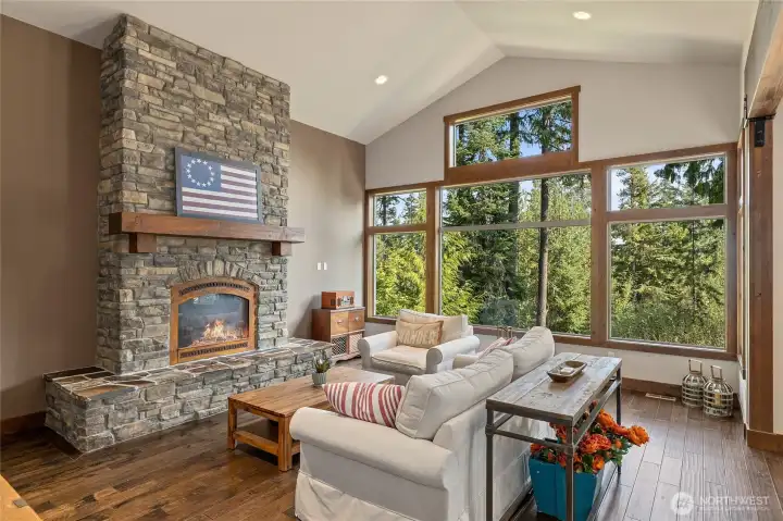 Great room with stone fireplace and tons of natural light!