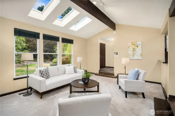 Skylights with remote shades add to the overall  brightness of the living space.