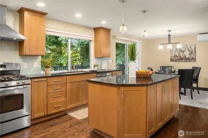 Large open kitchen with slab granite deep sink, 5 burner gas stove