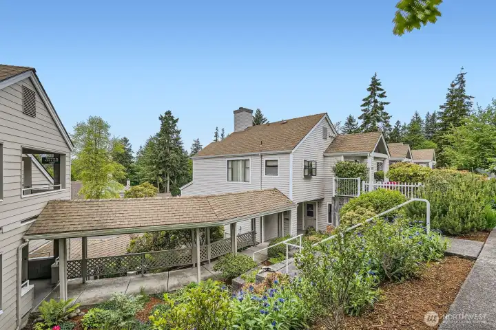 From the front, you can park on the street and walk down to the breezeway.  Enter the unit through the exterior door and the unit's front door is first on your left.