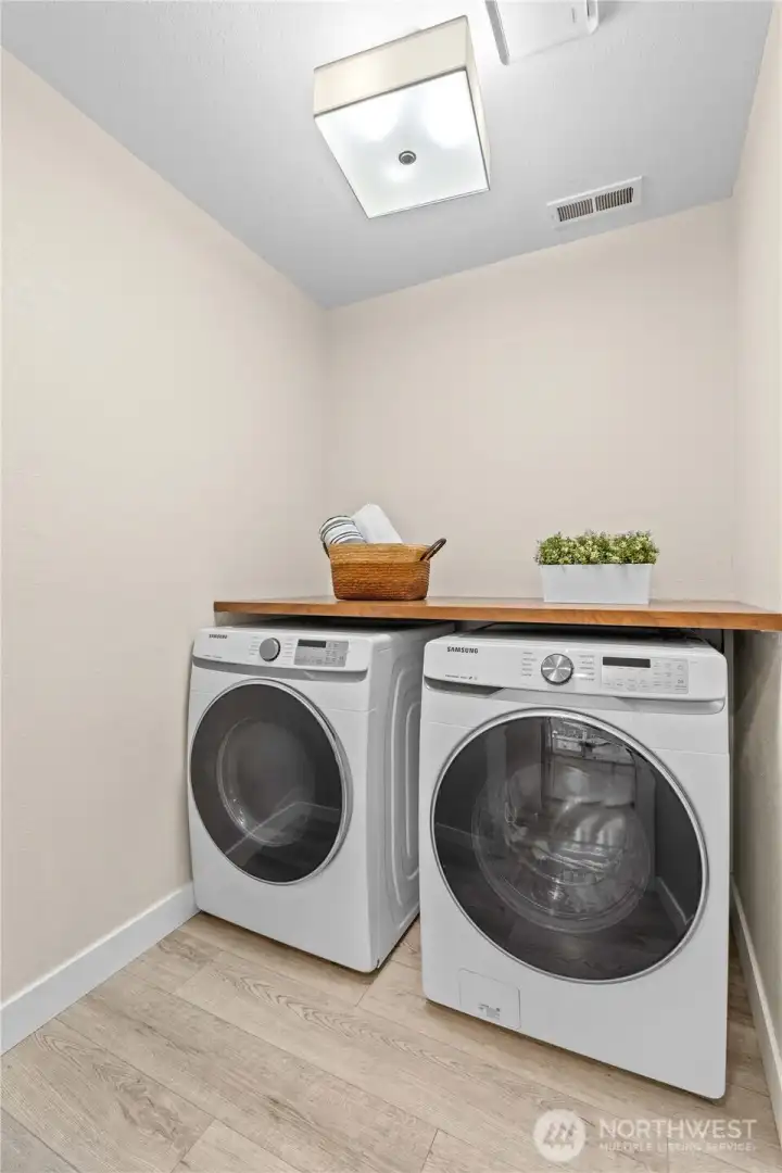Laundry area accented with a stylish barn door