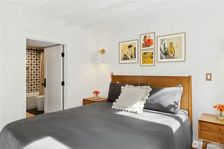 On the fully finished lower level, this inviting third bedroom offers fresh updated finishes, charming ceiling detail, and abundant natural light. With a private entrance and its attached bath, it’s ideal for guests, multi-generational living, or a secluded home office suite.