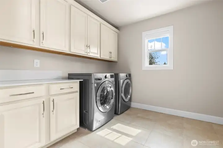 Laundry with built in cabinets