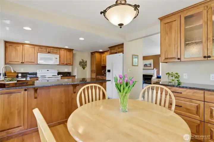 Enjoy flexible dining options—gather around the kitchen table or pull up a seat at the breakfast bar, both perfect for easy, inviting morning meals.