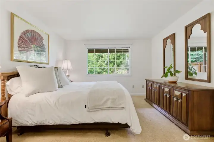 The primary suite offers a walk-in closet and an exceptionally large ensuite bathroom, creating a comfortable and private retreat.