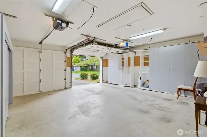 The home includes two additional uncovered parking stalls just outside, along with nearby guest parking