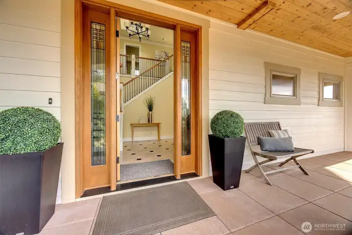 The covered entry feels intentional and inviting-warm wood tones, clean design, and just enough space to pause before stepping inside. It sets the tone for the rest of the home: comfortable, thoughtful, and easy to live in.