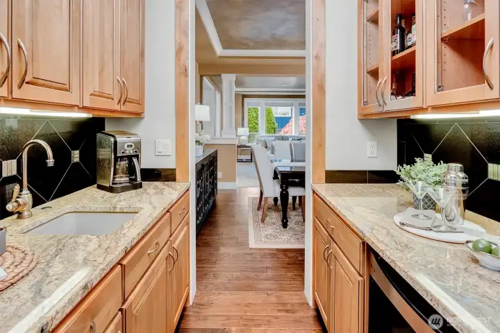A thoughtful extension of the dining room and kitchen that adds both function and flexibility. With generous counter space, additional storage, and a built-in wine refrigerator, this butler’s pantry makes entertaining easier and keeps everything organized just out of sight.