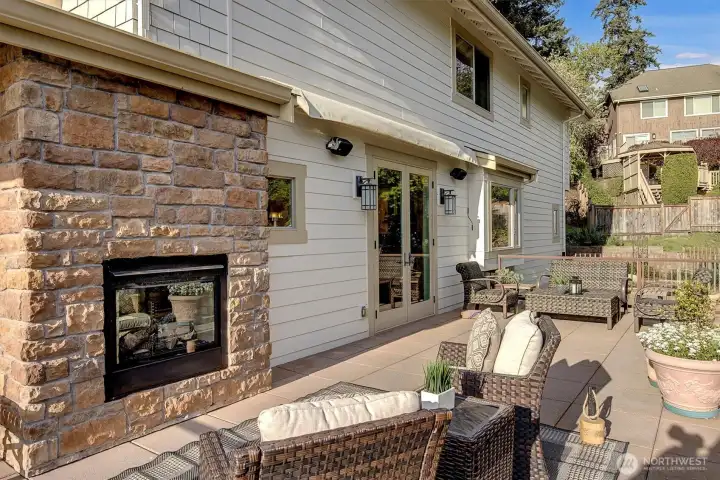 The exterior fireplace adds warmth and ambiance, making it just as comfortable on cool evenings as it is on sunny afternoons.