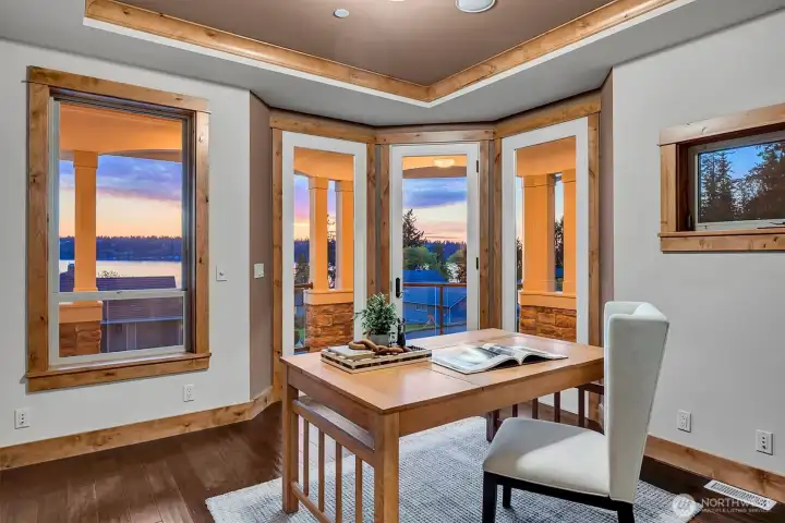 This light-filled space offers flexibility for how you live. Surrounded by windows and a glass door that opens to the covered deck.  It’s an ideal spot for a home office, reading room, or quiet retreat.
