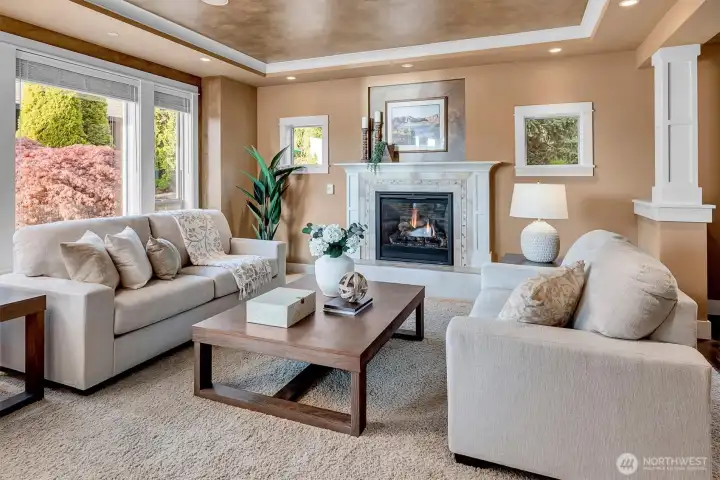 This is the kind of space people naturally gather in. The fireplace centers the room, while soft natural light and warm tones create a comfortable, everyday elegance.