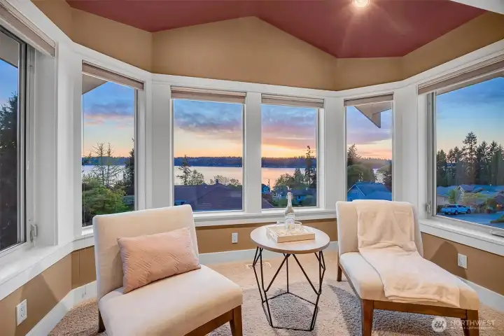 This cozy sitting area is all about the view. Surrounded by windows, it’s the kind of space you naturally gravitate toward.