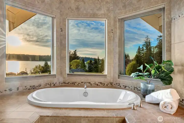 A standout feature of the home, the soaking tub is positioned to take full advantage of the view. Surrounded by windows, it creates a spa-like experience where you can truly relax and unwind while looking out over the water.