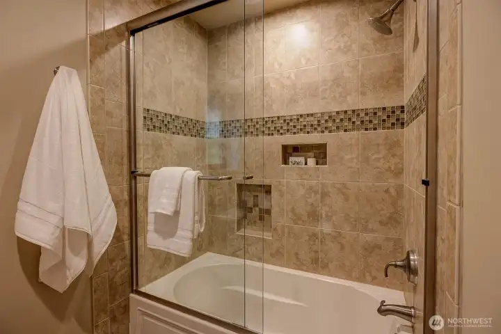 A door separates  the tub/shower area for extra privacy.