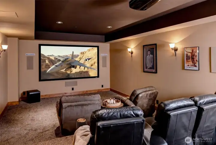 A true at-home theater experience designed for comfort and immersion. The oversized screen, projector system, and tiered seating create the feeling of a private cinema, while soft lighting and rich tones make it easy to settle in and unwind.