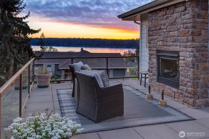 Step outside to a private view deck designed for everyday relaxation and memorable evenings. With a built-in fireplace and expansive lake views, it’s the perfect place to unwind while watching the sun dip below the horizon.