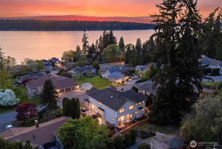From above, the home’s thoughtful design and expansive footprint truly stand out. Surrounded by lush greenery.