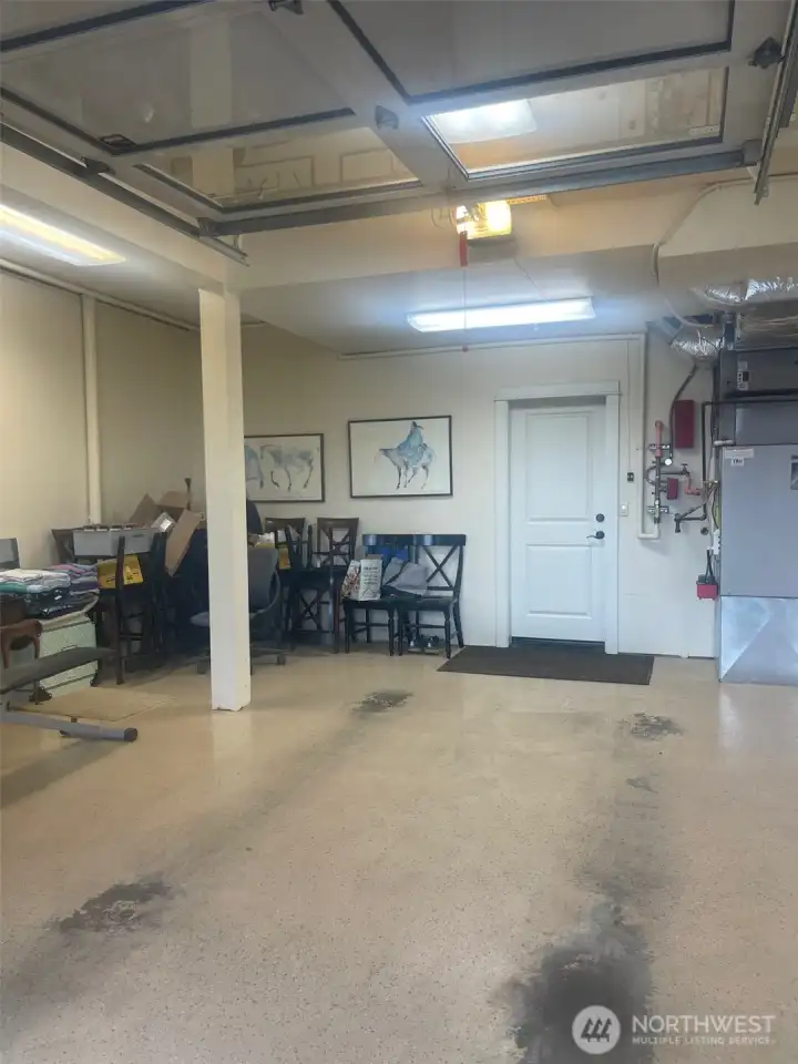 The first bay in the garage has tons of storage space to the right.