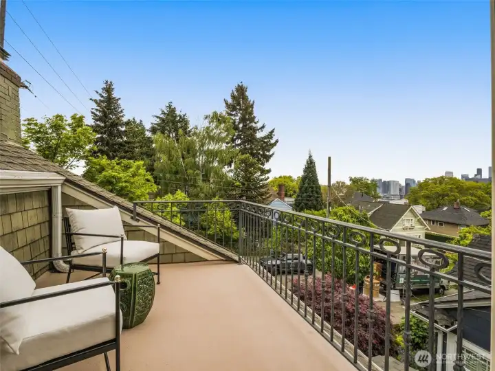 Primary bedroom deck with views of the city