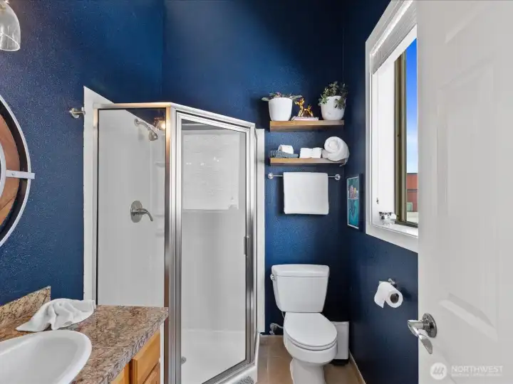 The primary bathroom upstairs has amazing natural light and room for everything.