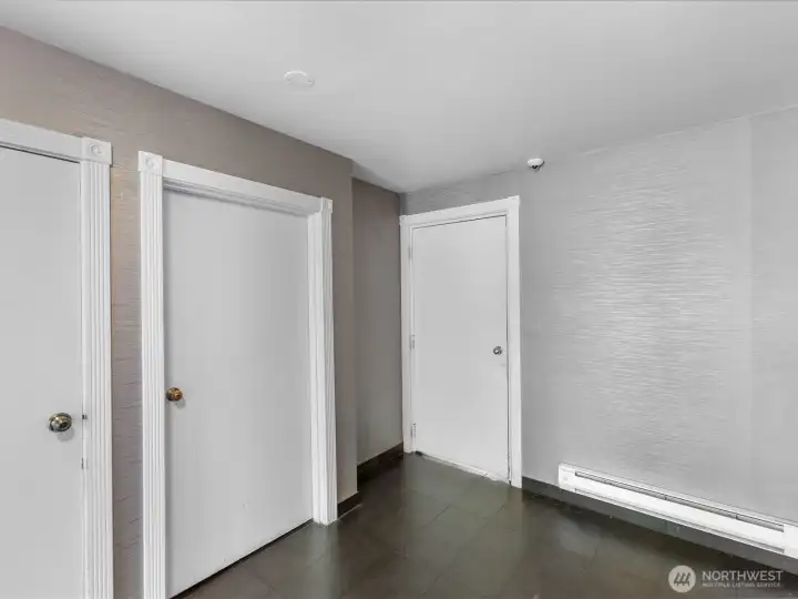 The door on the right leads to the garage.  The elevator is just steps away making it very convenient at the end of the day.