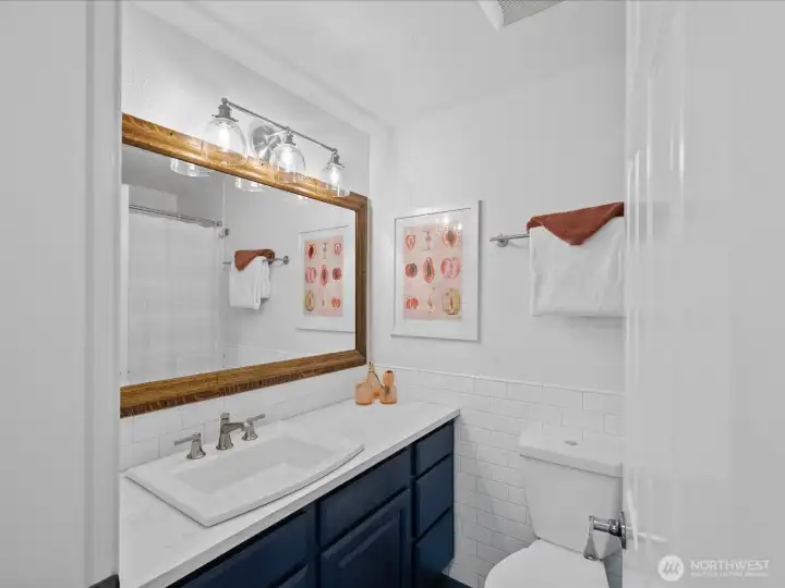 The bathroom on the first floor has everything you need including a tub!